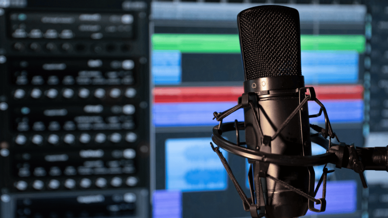 Audiobook recording setup with microphone representing ElevenLabs vs Play.ht AI voice generator comparison for audiobooks